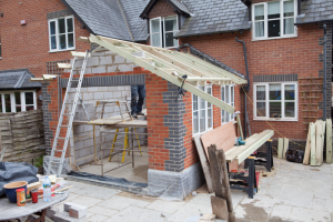 home extension construction UK building cost stage structure work in progress”