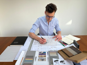 Architect discussing house extension budget UK planning and design consultation”