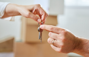 buy to let property UK landlord giving keys to tenant