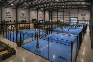 Warehouse converted into an indoor sports facility with padel courts and high clear-span structure in the UK