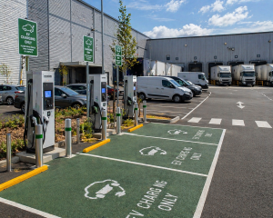 EV charging stations installed at an industrial warehouse site with fleet and parking areas