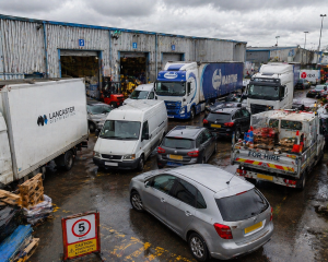 Congested warehouse yard with multiple vehicles showing poor access and layout issue
