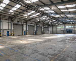 Empty warehouse industrial building in the UK showing potential investment opportunity