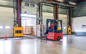 Operational warehouse in the UK with active loading yard and vehicles showing functional industrial use