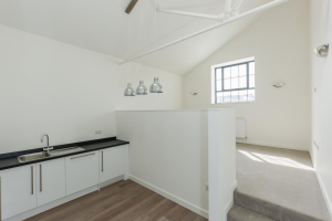Renovated upper floor flat above shop in the UK showing successful residential conversion